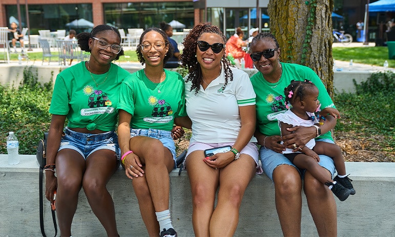 four women smiling